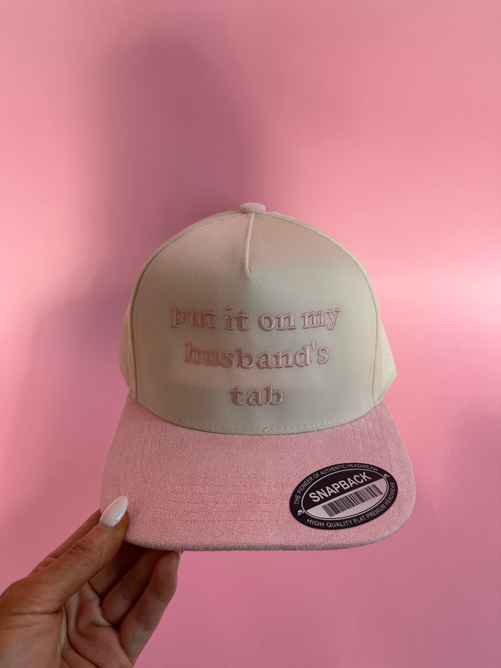 Put It On My Husbands Tab Trucker Hat